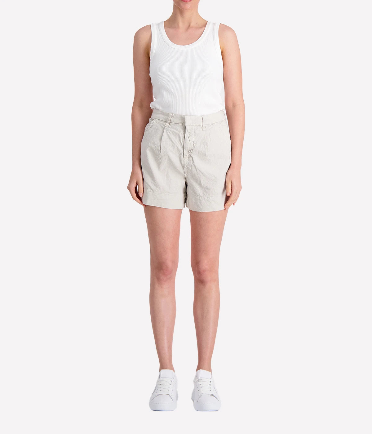 Lightweight tailored shorts in cement grey, featuring a mid-rise fit, sleek silhouette, clean waistband, and side pockets.