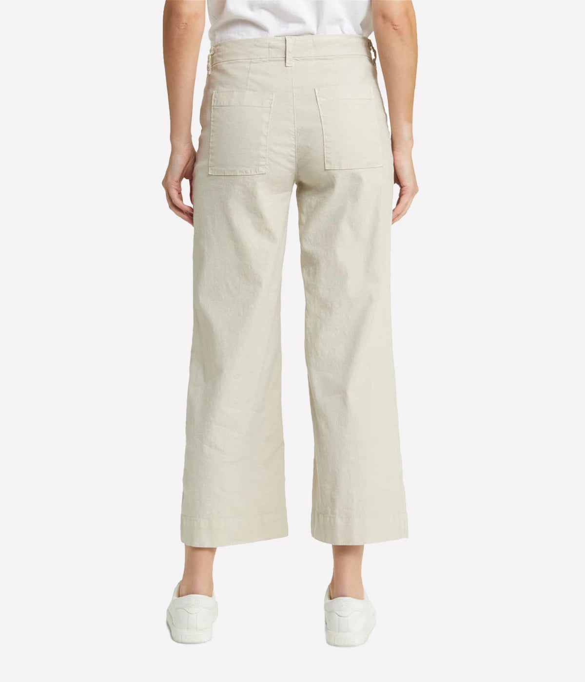 High-rise, wide-leg linen pants with a cropped hem and clean design, styled with a silk blouse and heels for a polished look.