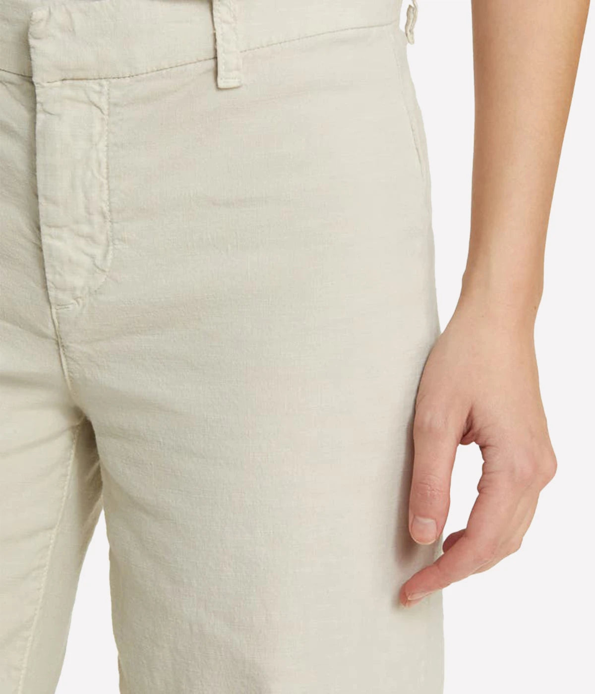 High-rise, wide-leg linen pants with a cropped hem and clean design, styled with a silk blouse and heels for a polished look.