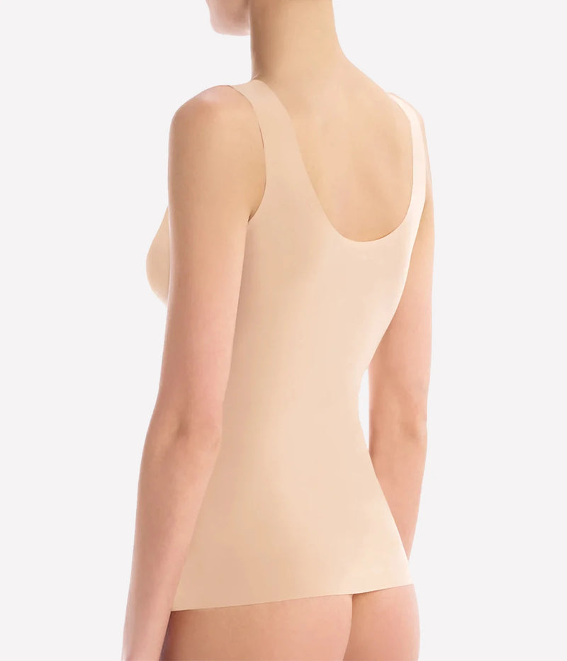 The Whisper Weight Cami is the lightweight layer you'll wear with everything or as a tight-fitting second layer. Constructed with a breathable European microfiber that disappears against the skin, finished with raw-cut edges that lay flat against the body for a seamless look, in a neutral beige colour. Everyday wear or underwear.