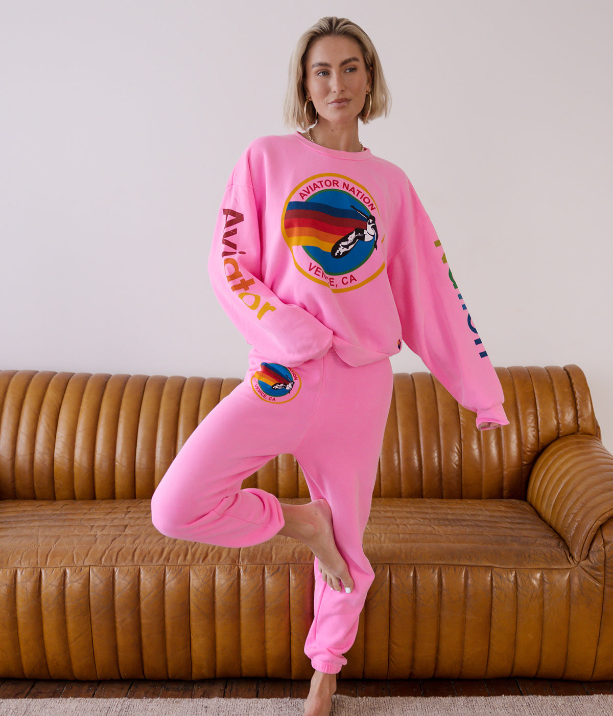  Ultra-soft sweatpants with unique stitching detail, shown in a casual lounge setting.
