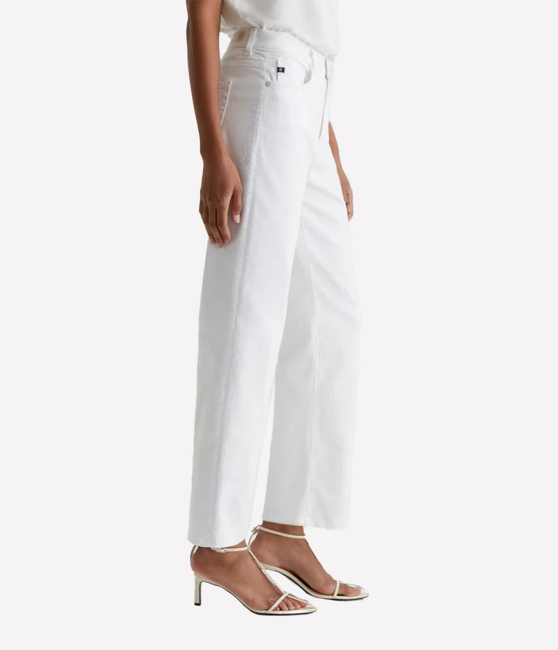 Person wearing white pants on a plain background