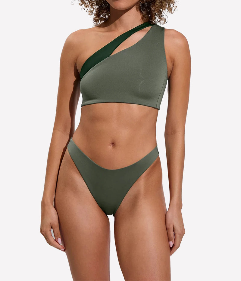 Model wearing the Left On Friday Dip Bottom in Agave with matching green swim top, front view.