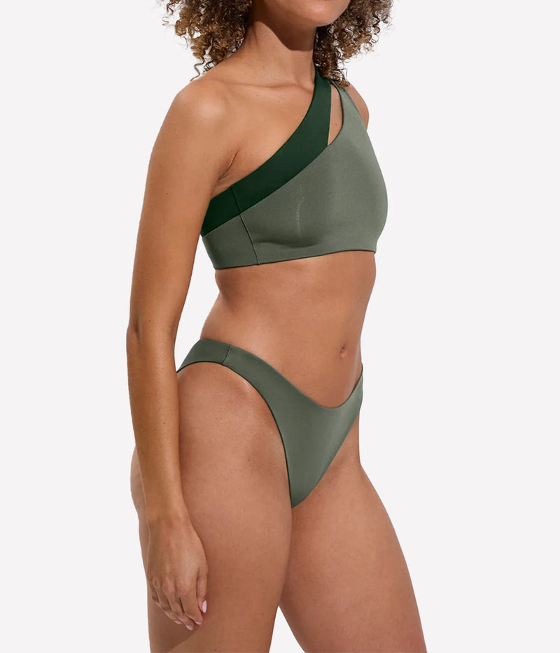 Model wearing the Dip Bottom in Agave with matching swim top, angled front view.