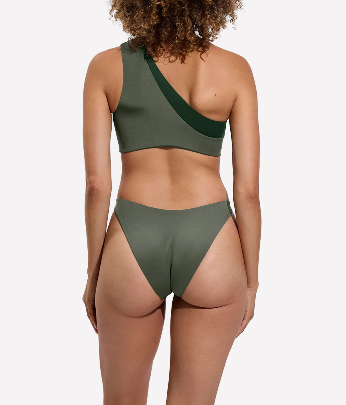 Model wearing the Dip Bottom in Agave with matching swim top, back view.