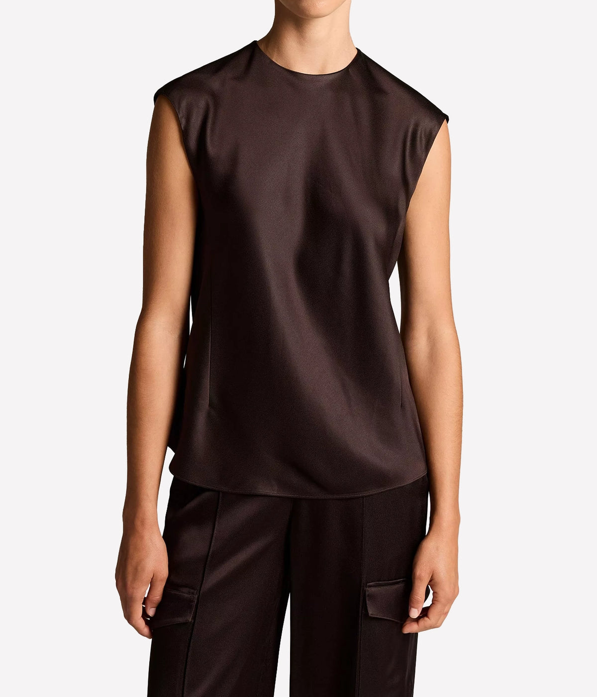 Front view of a model wearing the Vince Relaxed Cap Sleeve Top In Cinderwood untucked over matching cargo trousers, showing the crew neckline and cap sleeves