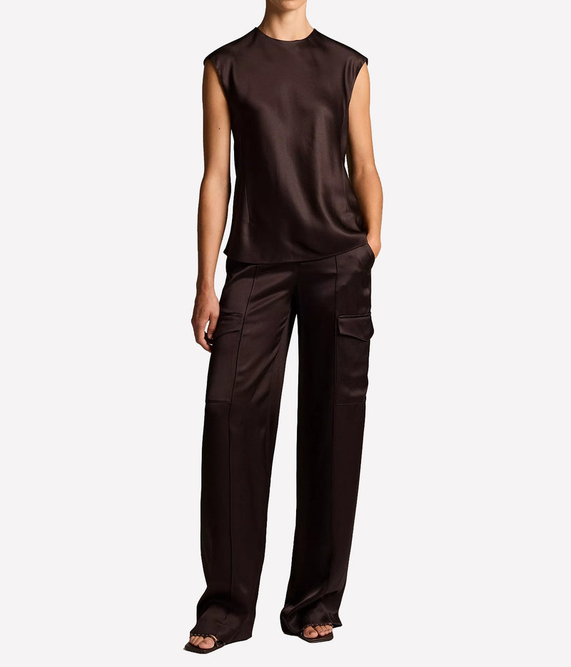 Full-length view of a model wearing the Vince Relaxed Cap Sleeve Top In Cinderwood with matching wide-leg cargo trousers and dark sandals