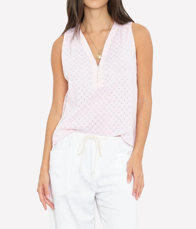 model wearing Xirena Miki Top in Pale rose - sleeveless light pink blouse with v neck and eyelet detailing