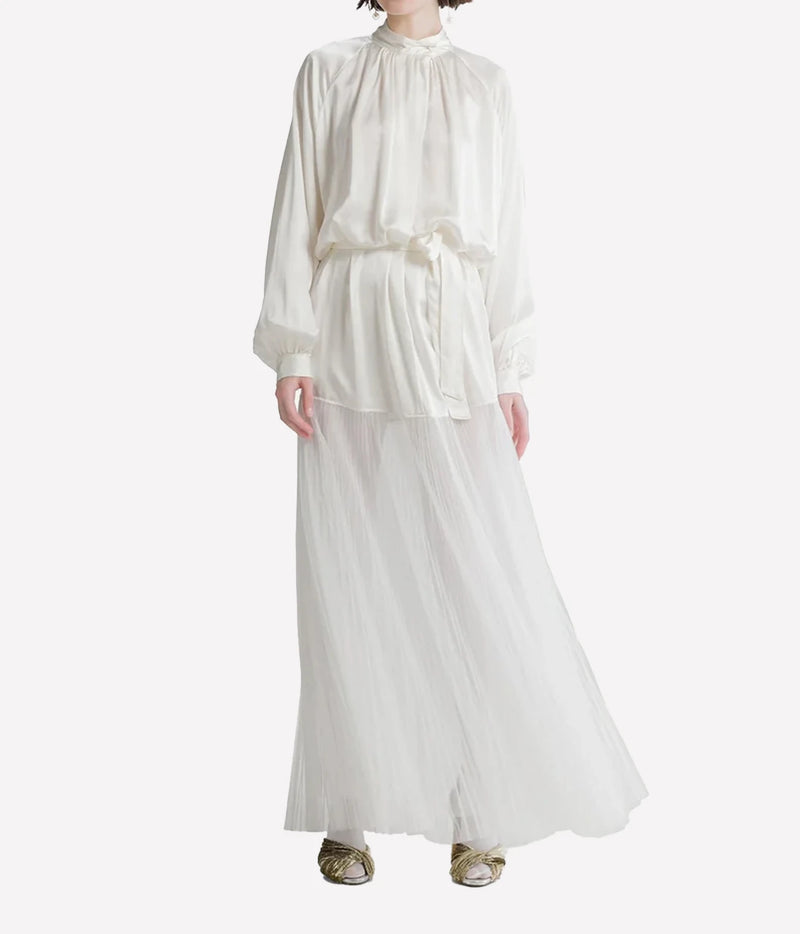Woman wearing the Forte Forte silk satin and plissé tulle dress in Diamond, full-length front view.