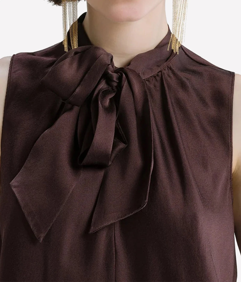 Close-up of the Forte Forte silk satin sash top in Fondant showing the tied neck sash.