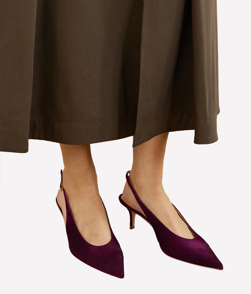 Model wearing the Gianvito Rossi Robbie Sling 55 in Bourgogne with an olive brown midi skirt, showing the pointed toe and kitten heel