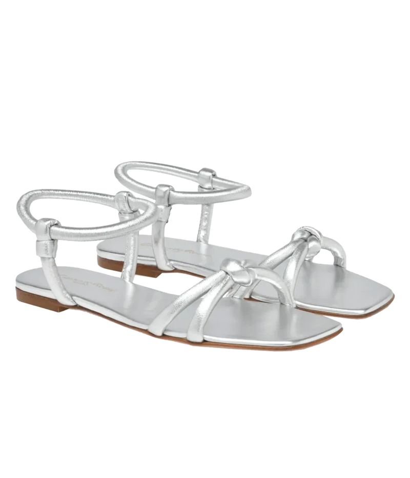 Pair of Gianvito Rossi Juno 05 Nappa in Silver angled from the side, showing the knotted crossover straps and buckled ankle straps