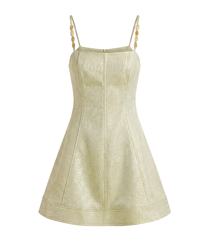 Alexis Josefin Dress In Gold Mist shown flat from the front, highlighting the square neckline, gold braided shoulder straps, seamed bodice and flared mini skirt in a shimmering pale gold and green textured fabric