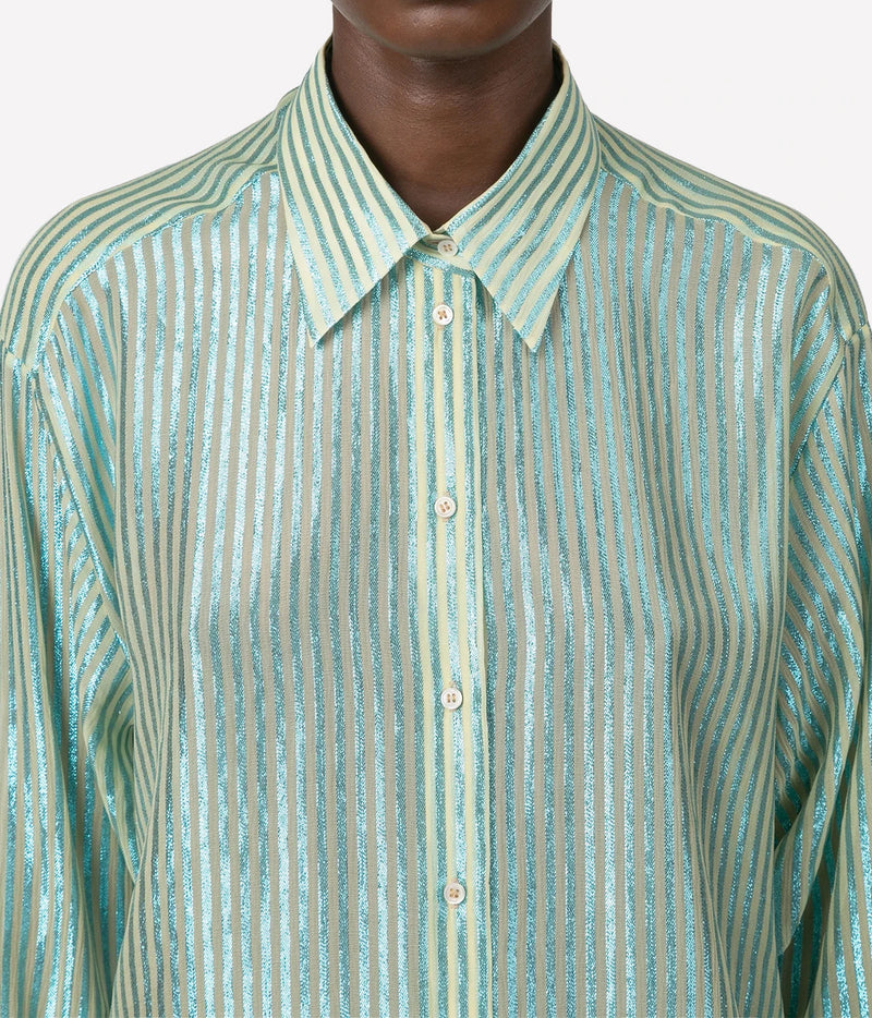 A close-up of a long-sleeve button-up shirt with a pointed collar, featuring vertical metallic stripes in a light mint green and silver colorway.
