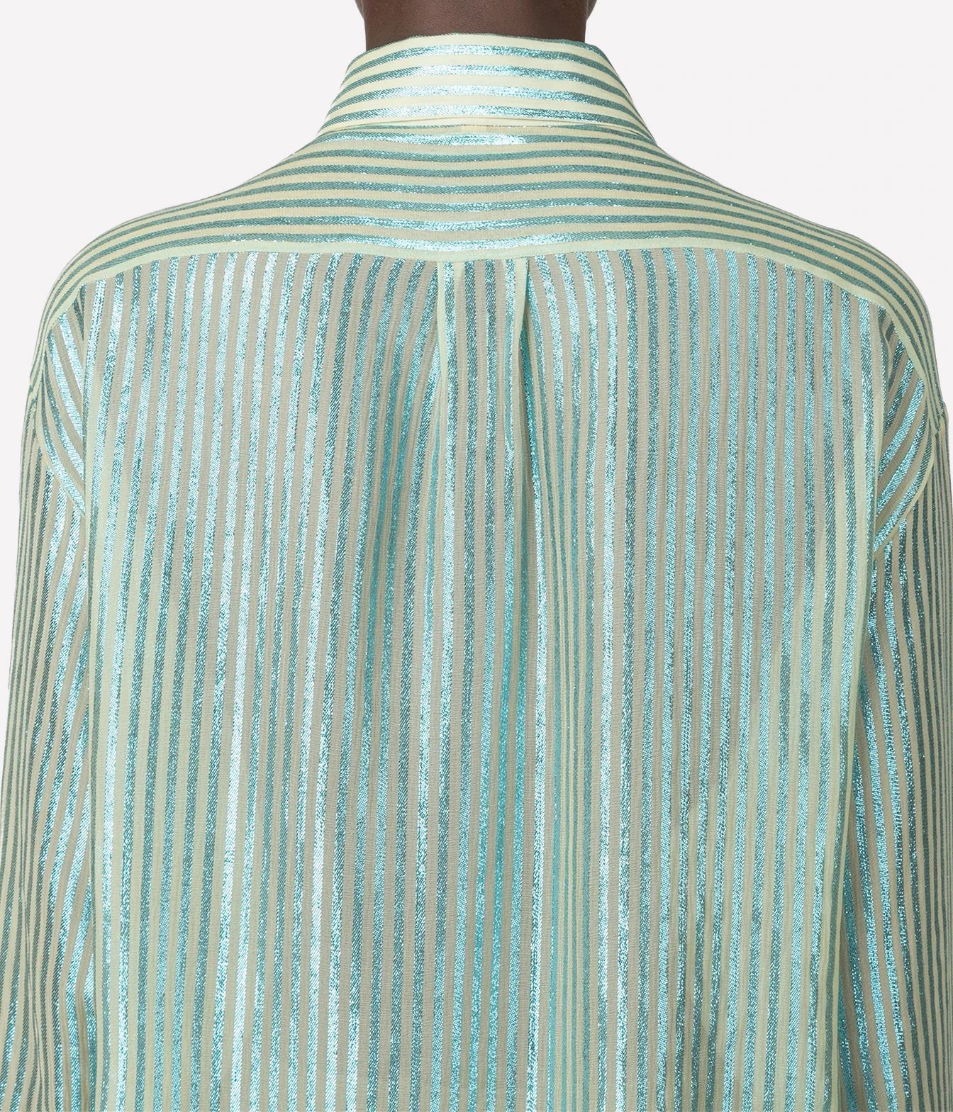 Close-up of the back of a long-sleeve collared shirt with vertical metallic stripes in a pale mint green and silver tone, shown on a mannequin against a light gray background.