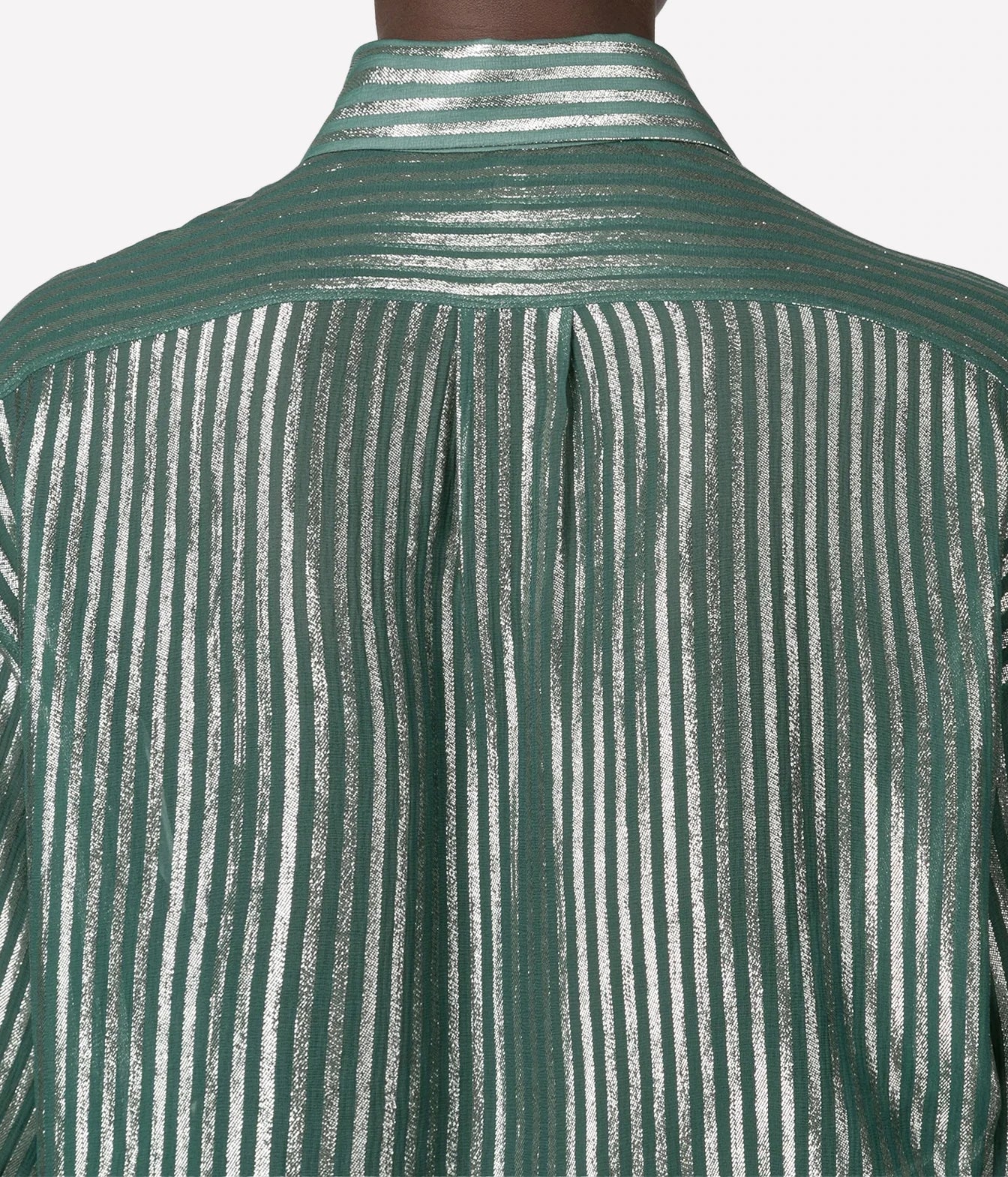 Close-up of the back of a metallic green shirt with vertical silver stripes and a high collar.