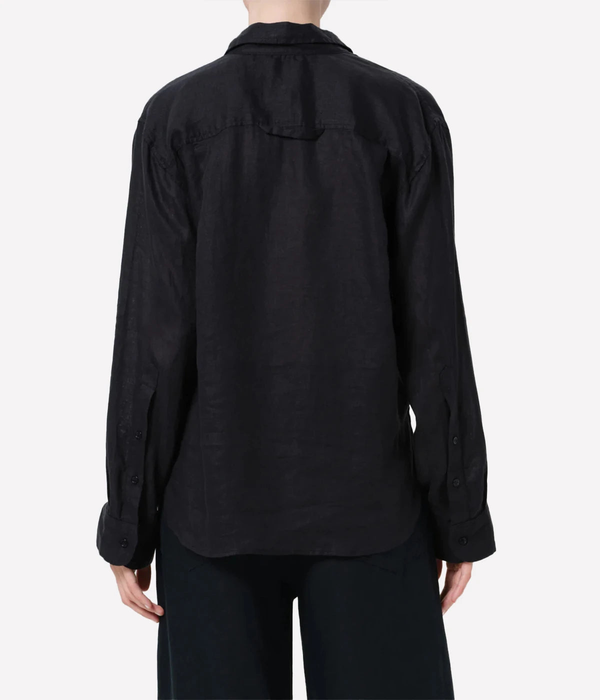 Black shirt worn by a person on a white background