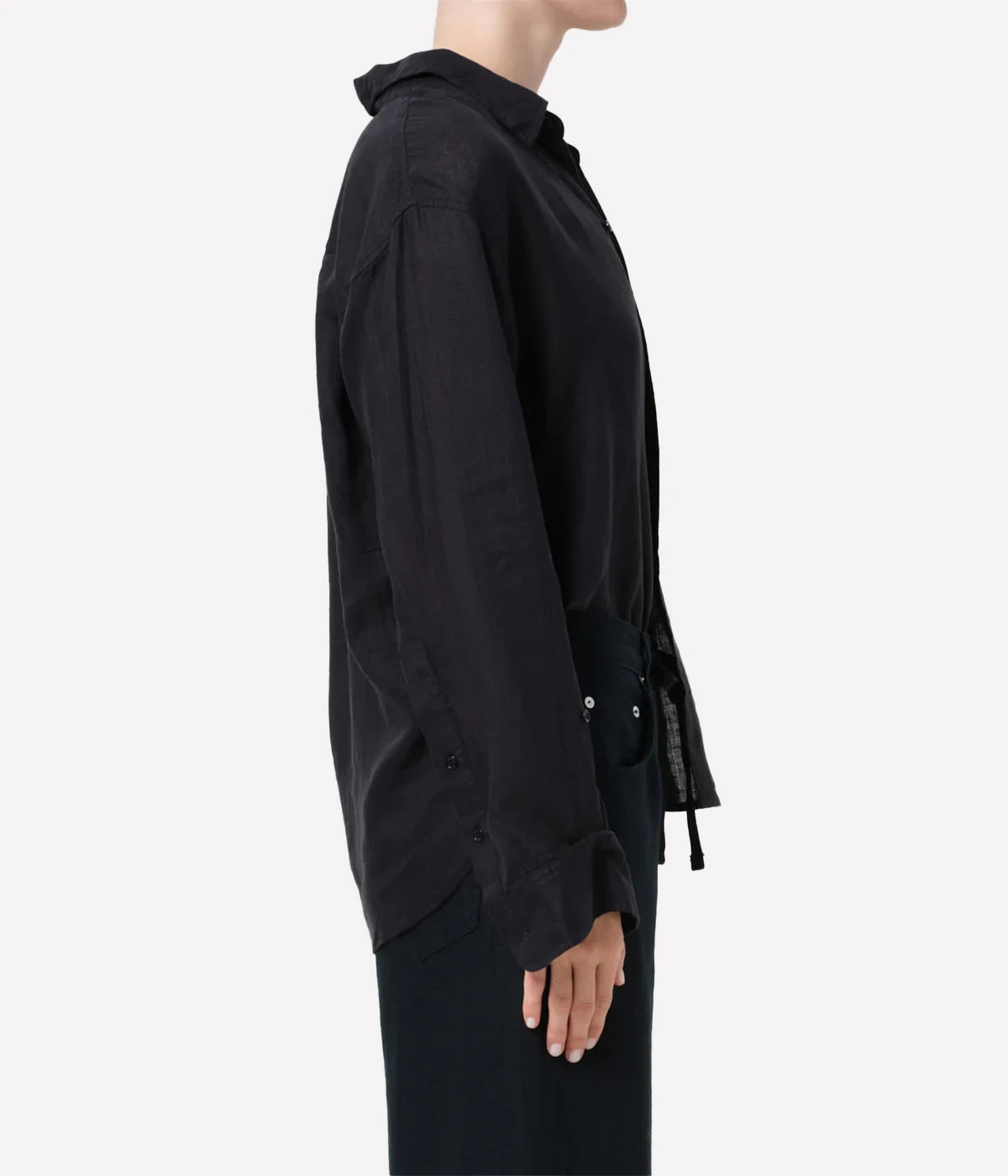 Black shirt worn by a person on a white background