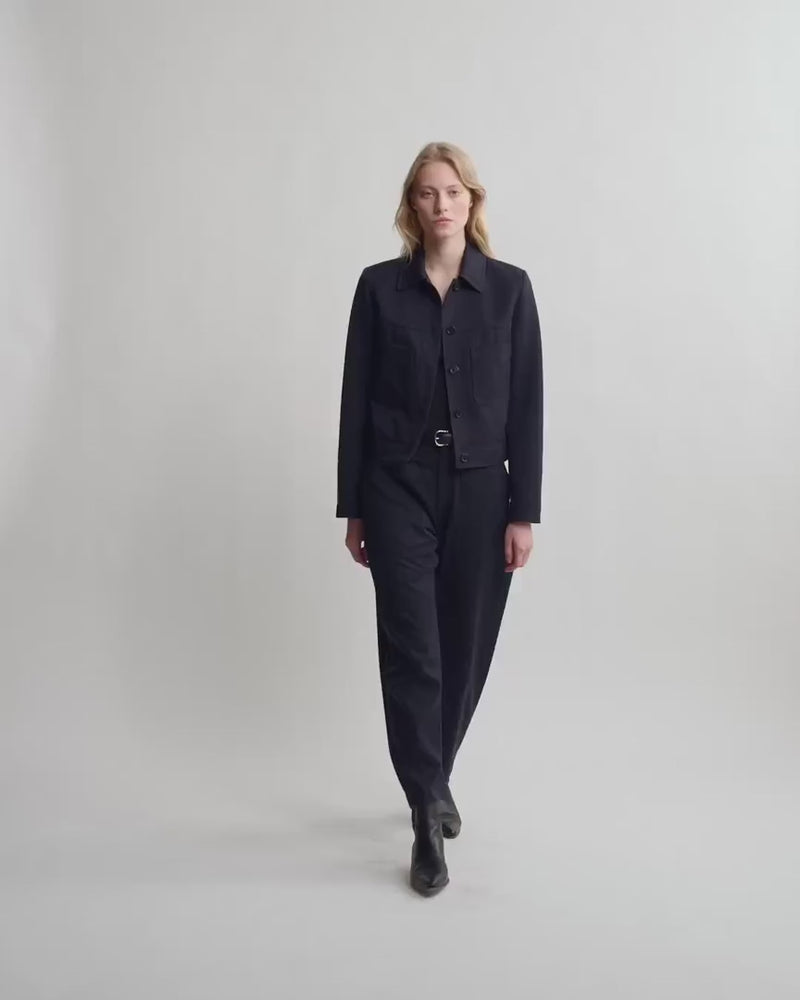 Model wearing Nili Lotan Shon Wool Pant in Midnight with matching cropped jacket, full-length view