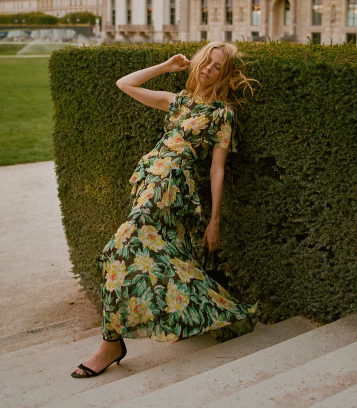 Model walking in the DÔEN Hesperia Dress In Hanbury Garden with black heeled sandals