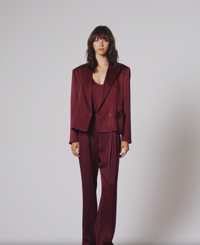 video of a model wearing the blaze milano Novalis Fox Pants Pant In Wine
and matching blazer and top in a deep red colour