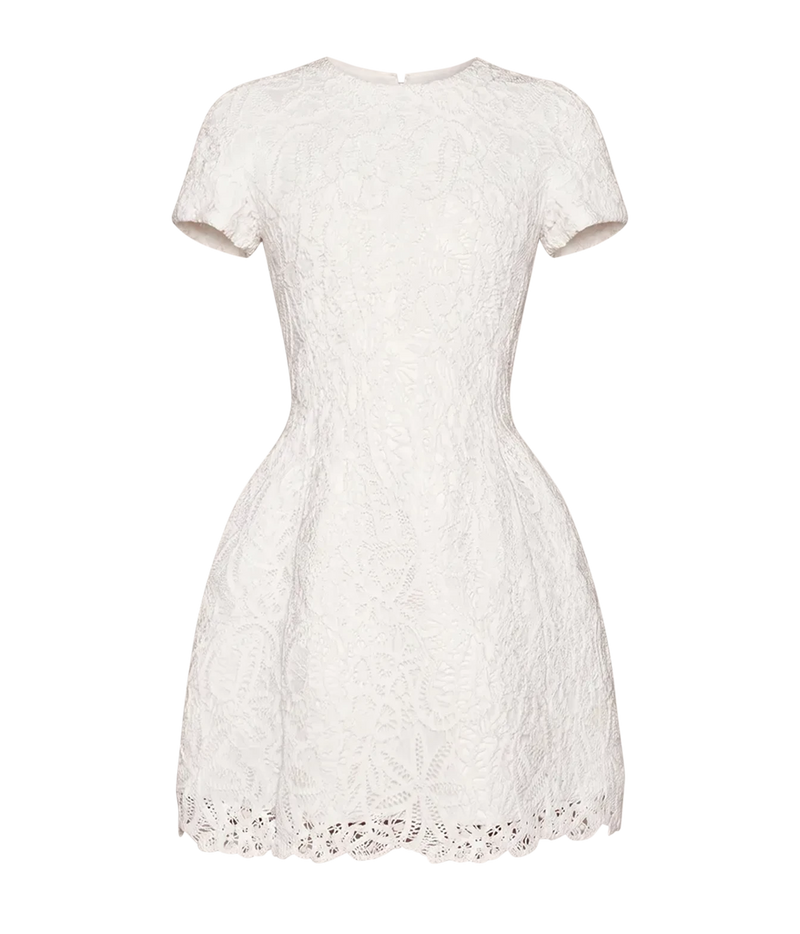 Alexis Regatta Dress In Floral Macrame shown flat from the front, showing the round neckline, short sleeves, fitted bodice and full mini skirt in white embroidered floral lace with a scalloped hem