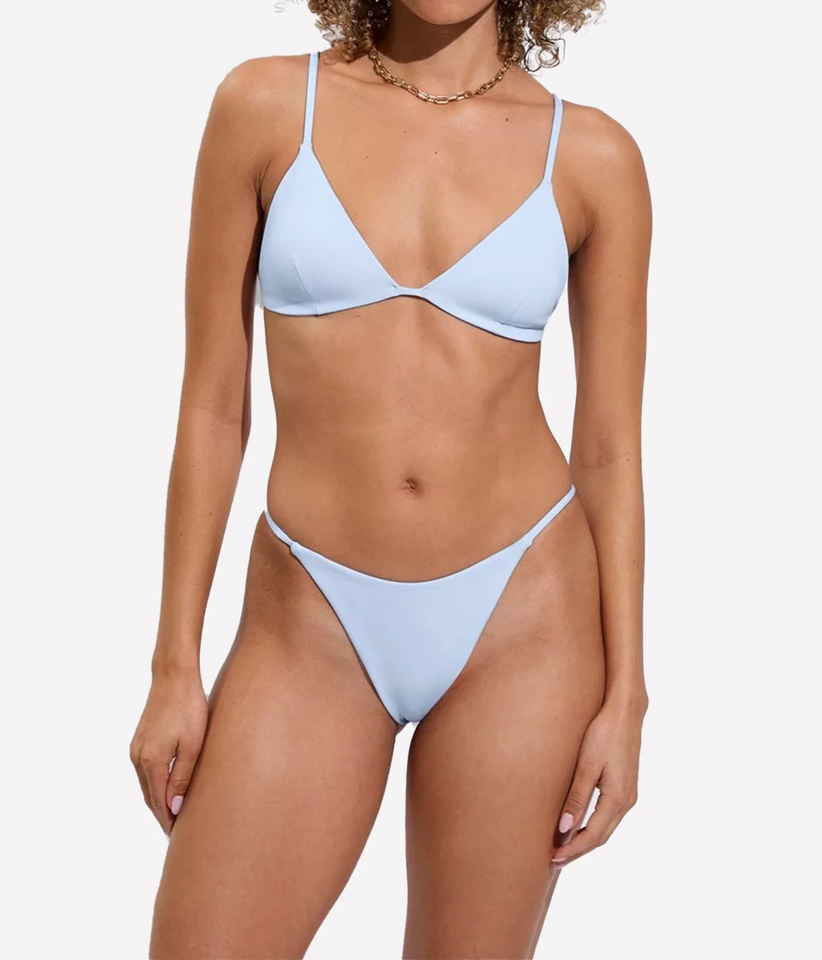 A model shown from the front wearing a bikini set in a sky blue colourway, Sandy Top In Blue Skies