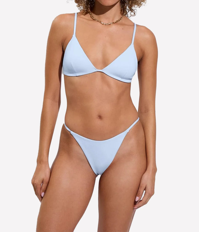 A model shown from the front wearing a bikini set in a sky blue colourway, Sandy Top In Blue Skies