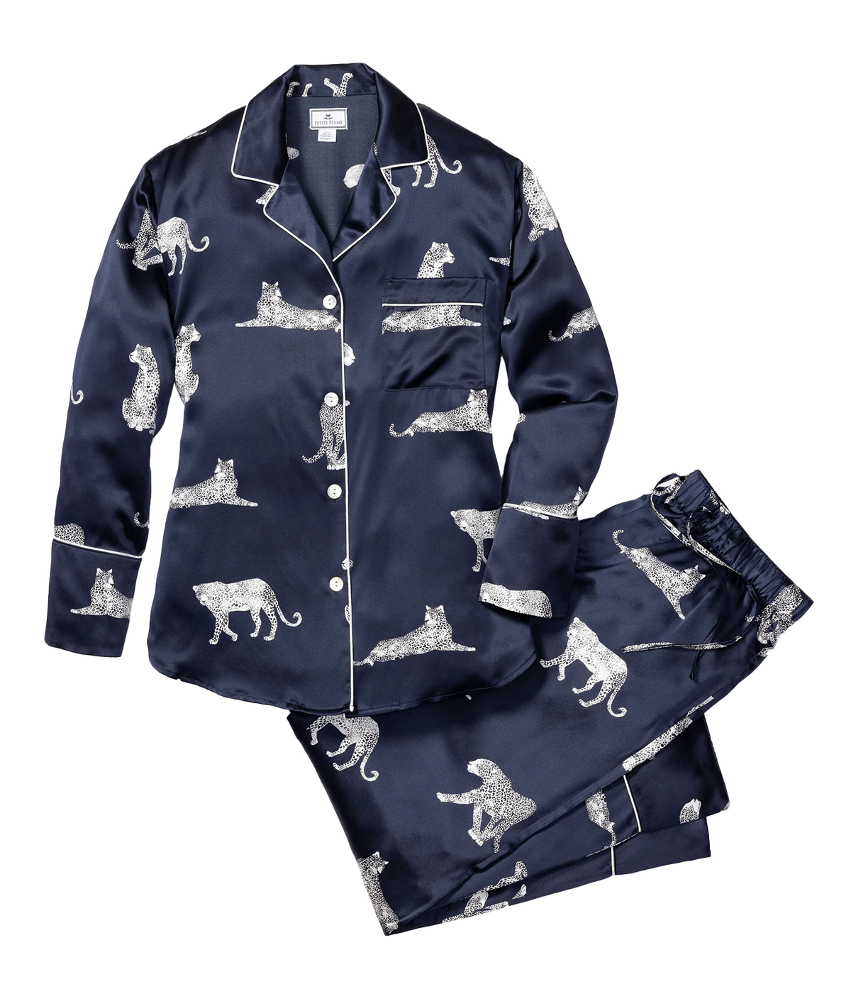 Petite Plume Mulberry Silk Long Pyjama Set in Panthère de Nuit laid flat, showing the button front collared shirt with white piping and a chest pocket and the matching straight leg pants in a white panther print
