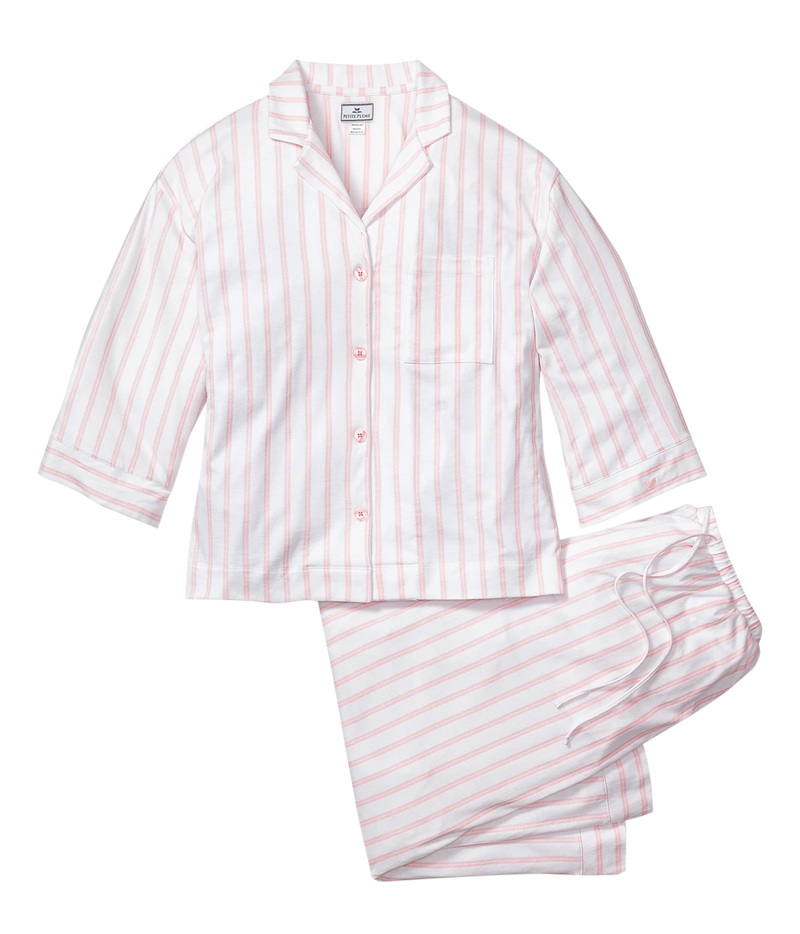 Petite Plume Olivia Pima Long Pyjama Set in Pink Stripe laid flat, showing the three-quarter sleeve button front shirt with a chest pocket and white piping and the matching drawstring pants in a pink and white stripe