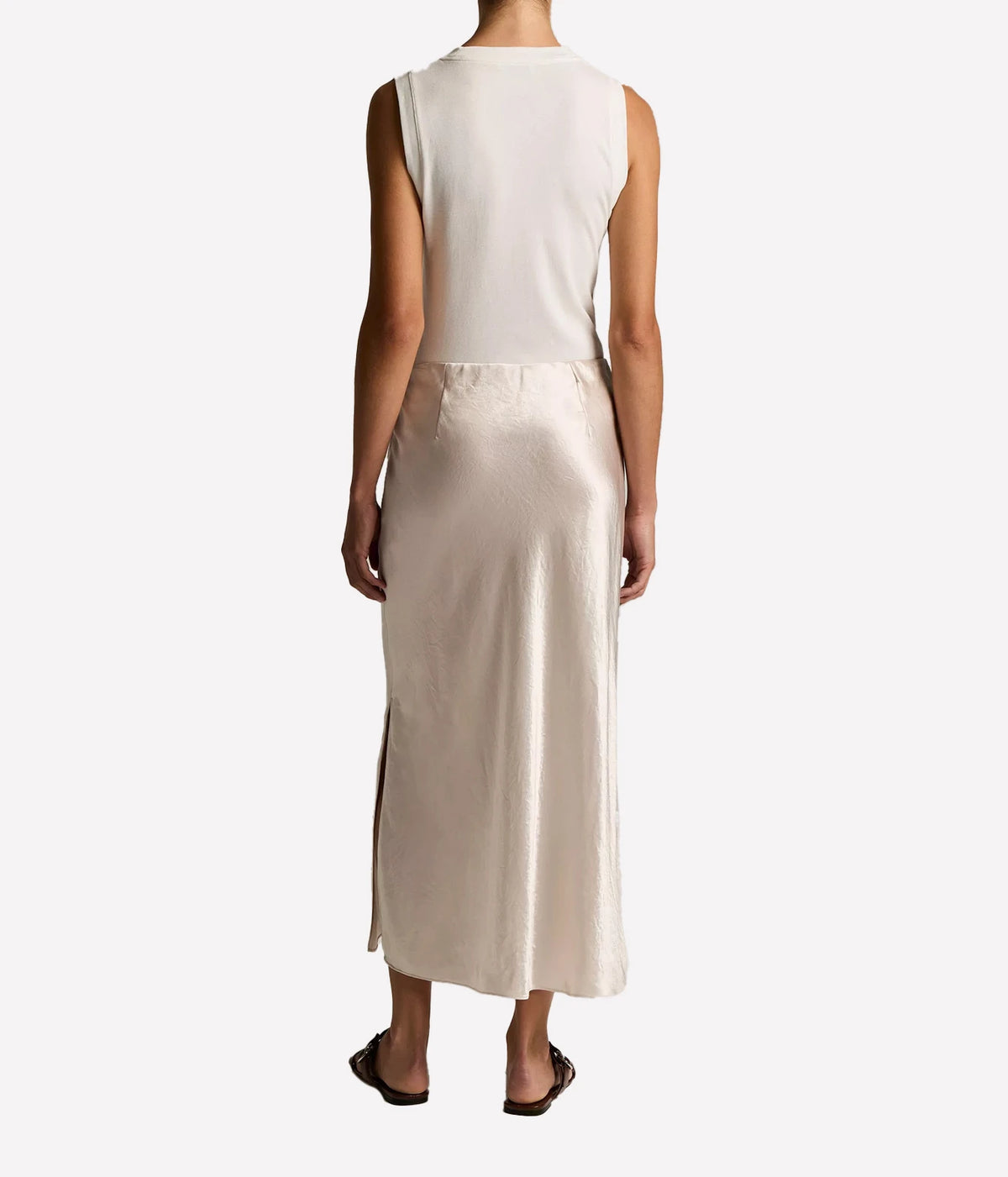 Vince Side Slit Slip Skirt in Champagne, shown from the back with a sleek, fluid midi-length silhouette.