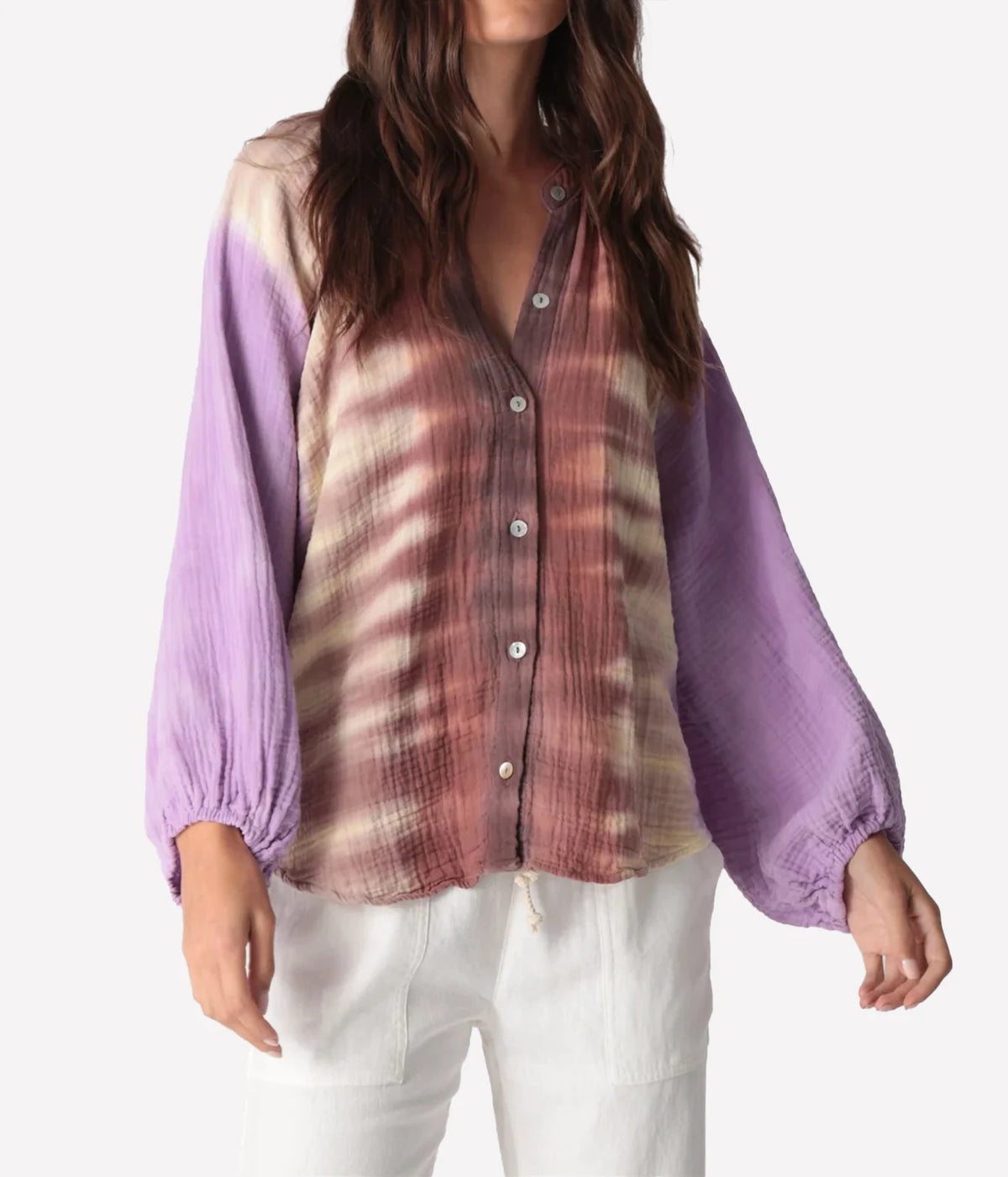 Front view of a model wearing the Electric Rose Winnie Fade Shirt in Lavender Sepia buttoned, showing the sepia tie-dye body, lavender balloon sleeves, band collar and buttons, with white trousers