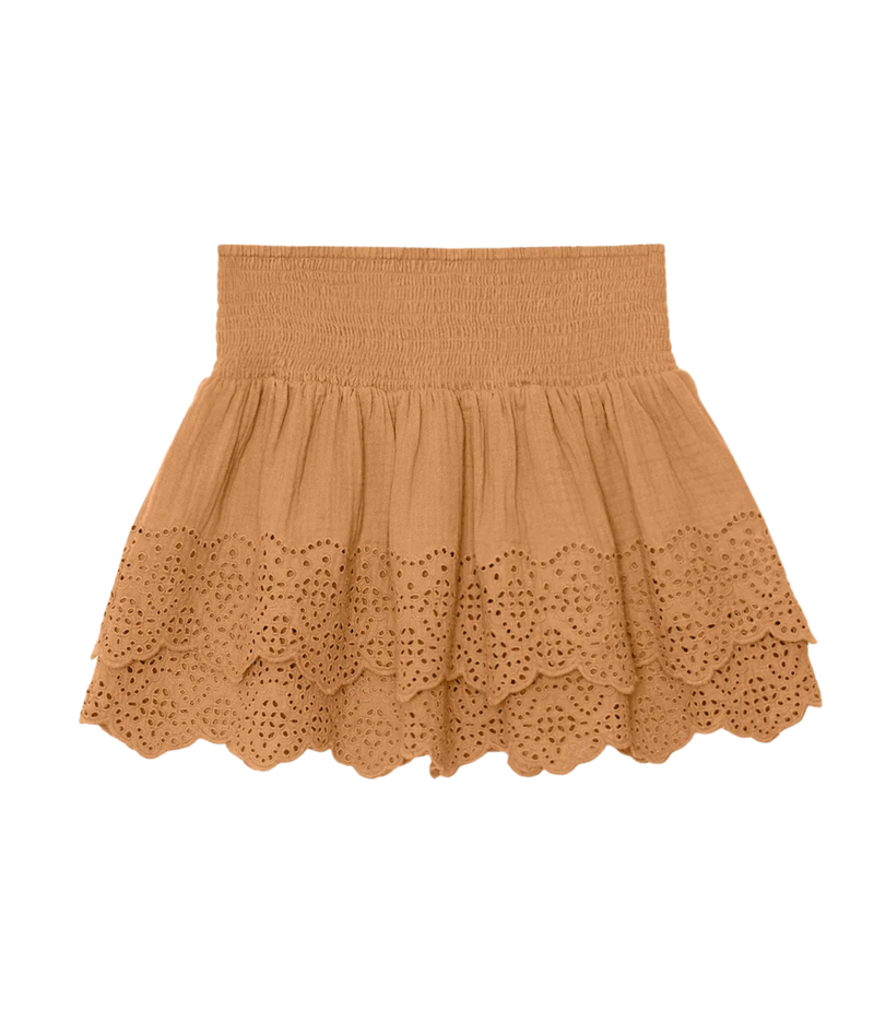 A tan eyelet cotton skirt with a smocked elastic waistband, shown flat against a solid white background.