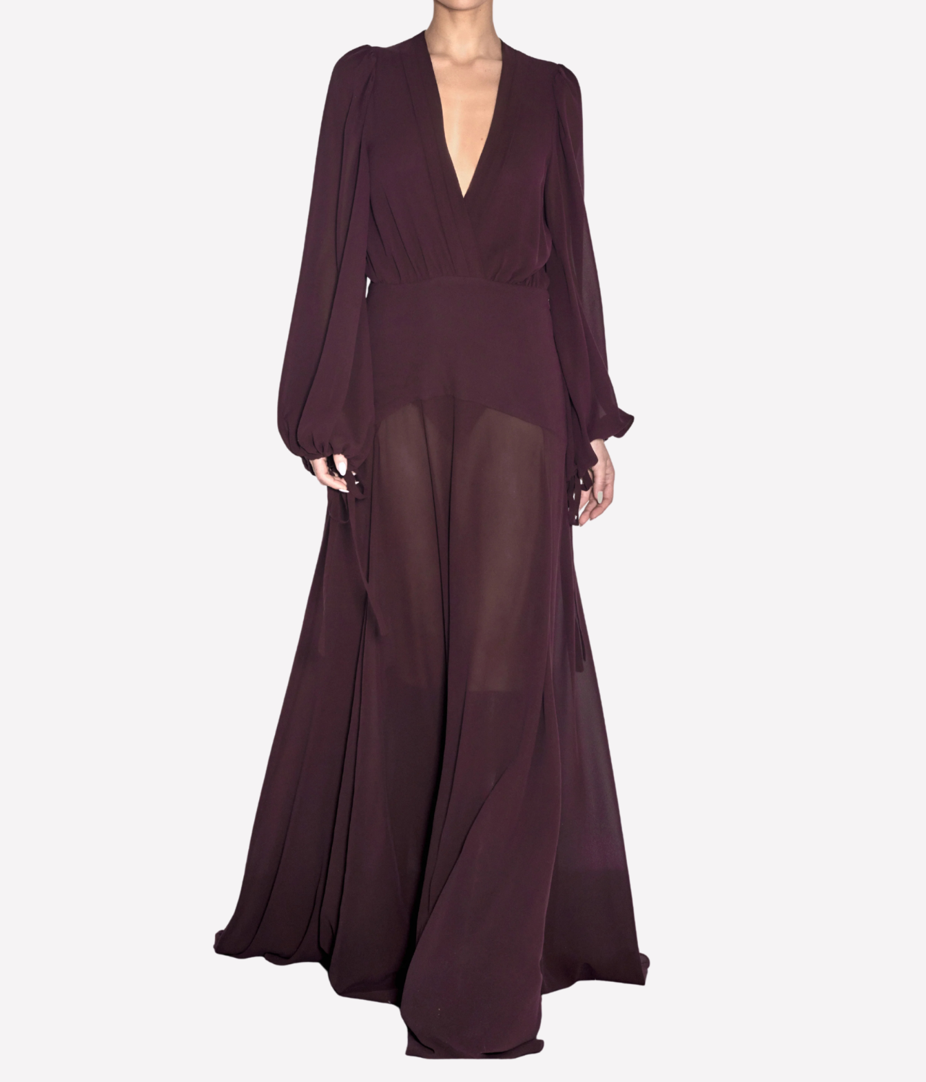 A floor-length dark plum maxi dress with long balloon sleeves, a deep V-neckline, and a sheer overlay skirt, shown on a model against a light gray background.