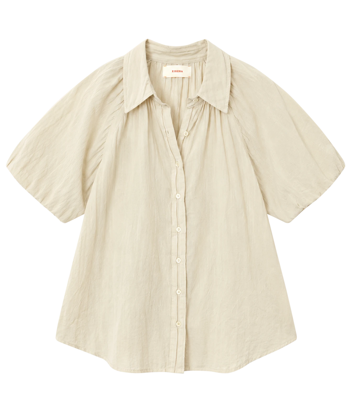 Xirena Lyla Shirt in Parchment laid flat, showing the point collar, button front and short balloon sleeves