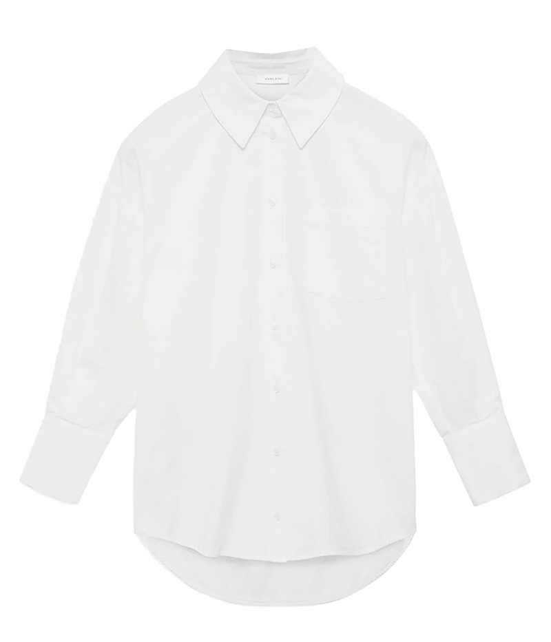 ALT text: Tailored white blouse with a higher front length and elongated back, showcasing a striking geometric silhouette for versatile styling.