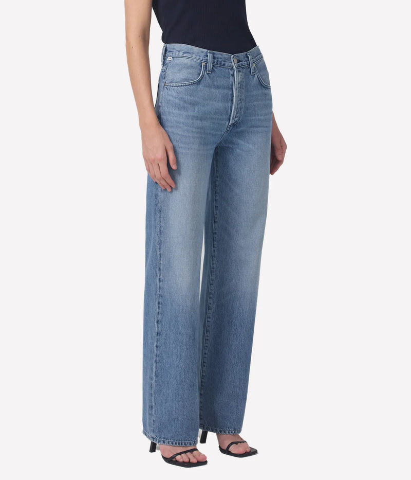 Citizens of Humanity Annina Trouser Jean in Light Catcher – lower half angled view on model highlighting high-rise waist, relaxed drape, and fluid wide-leg silhouette in organic cotton denim.
