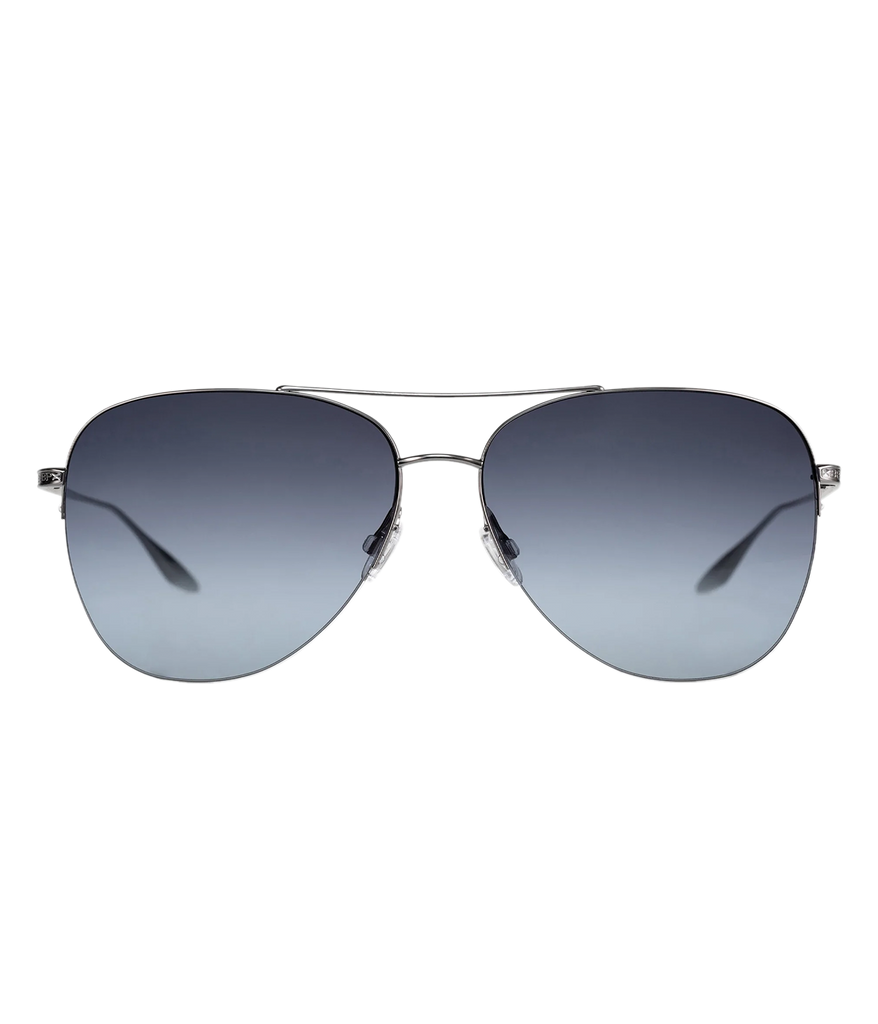 Image of an aviator style sunglass, with silver metal hardware and black gradient lenses. Featuring a intricate filigree etching at the double bridge and signature Barton Perreira engraving at the temples.