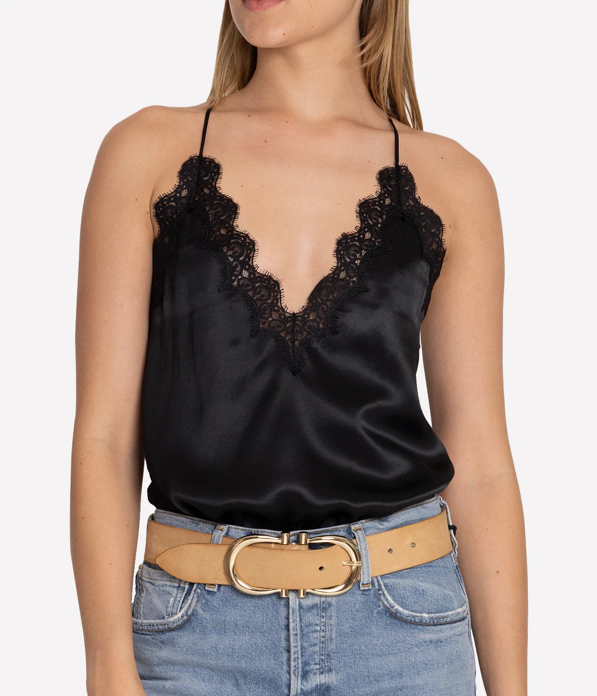 Image of a criss cross silk camisole in black, with scalloped lace-trimmed detailing, v neckline. Made Internationally, sexy date night top, sleeveless, date night top, adjustable straps. 