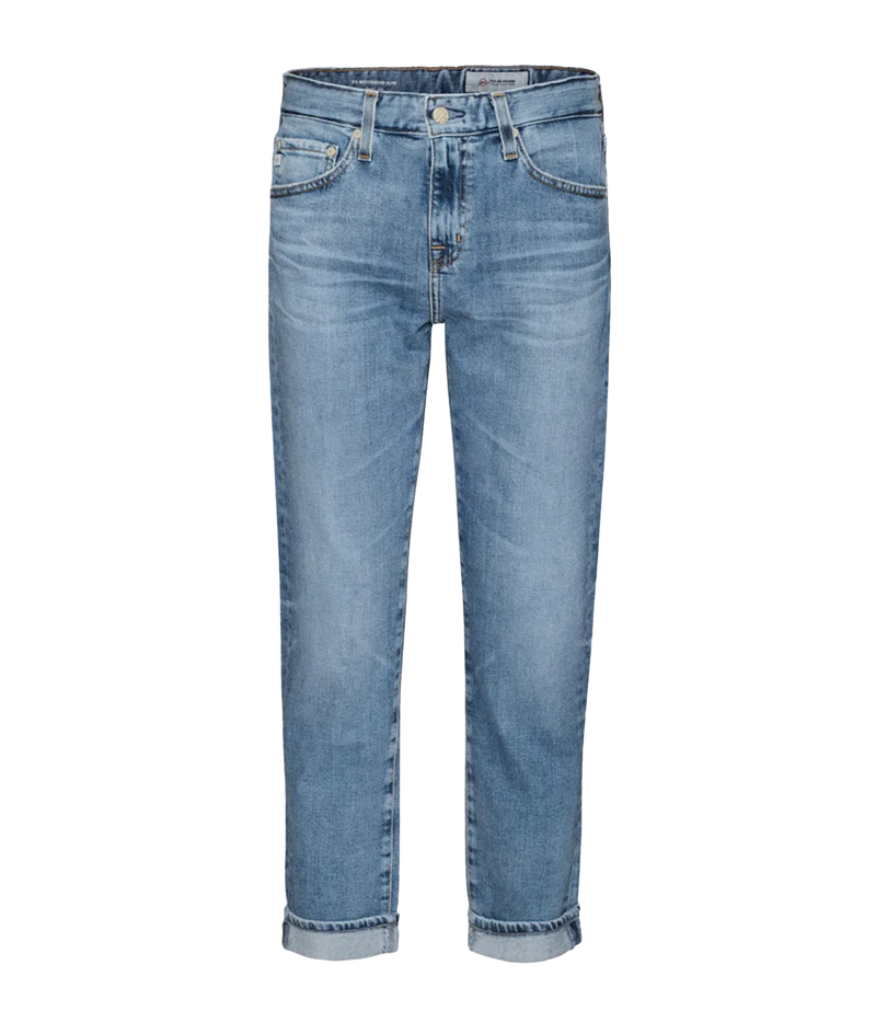 Image of a high waisted slouchy fit denim washed vintage inspired jean, with button and fly details. 