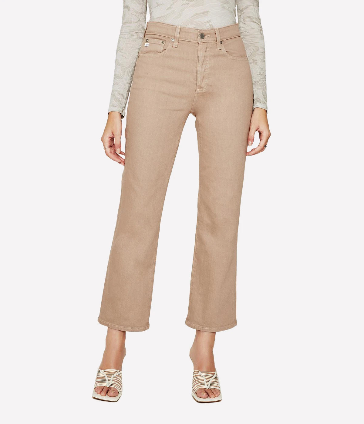 Cropped flare jeans in warm beige with an ultra-high waist, button fly, and subtle fading, styled for casual and polished looks.