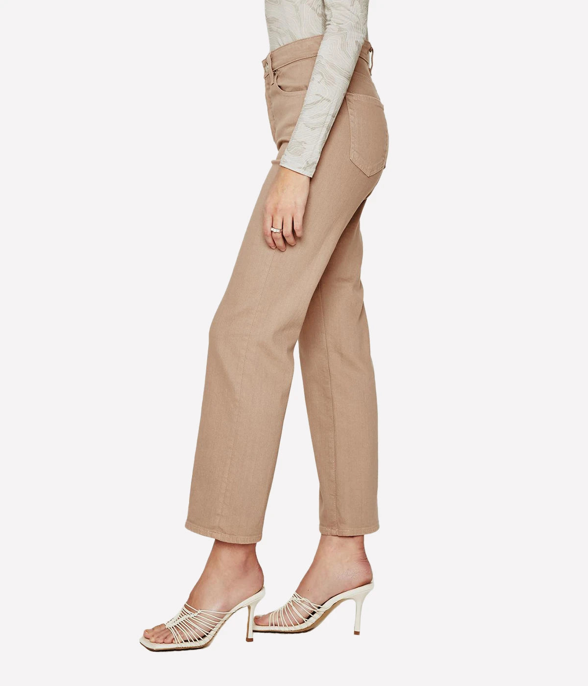 Cropped flare jeans in warm beige with an ultra-high waist, button fly, and subtle fading, styled for casual and polished looks.