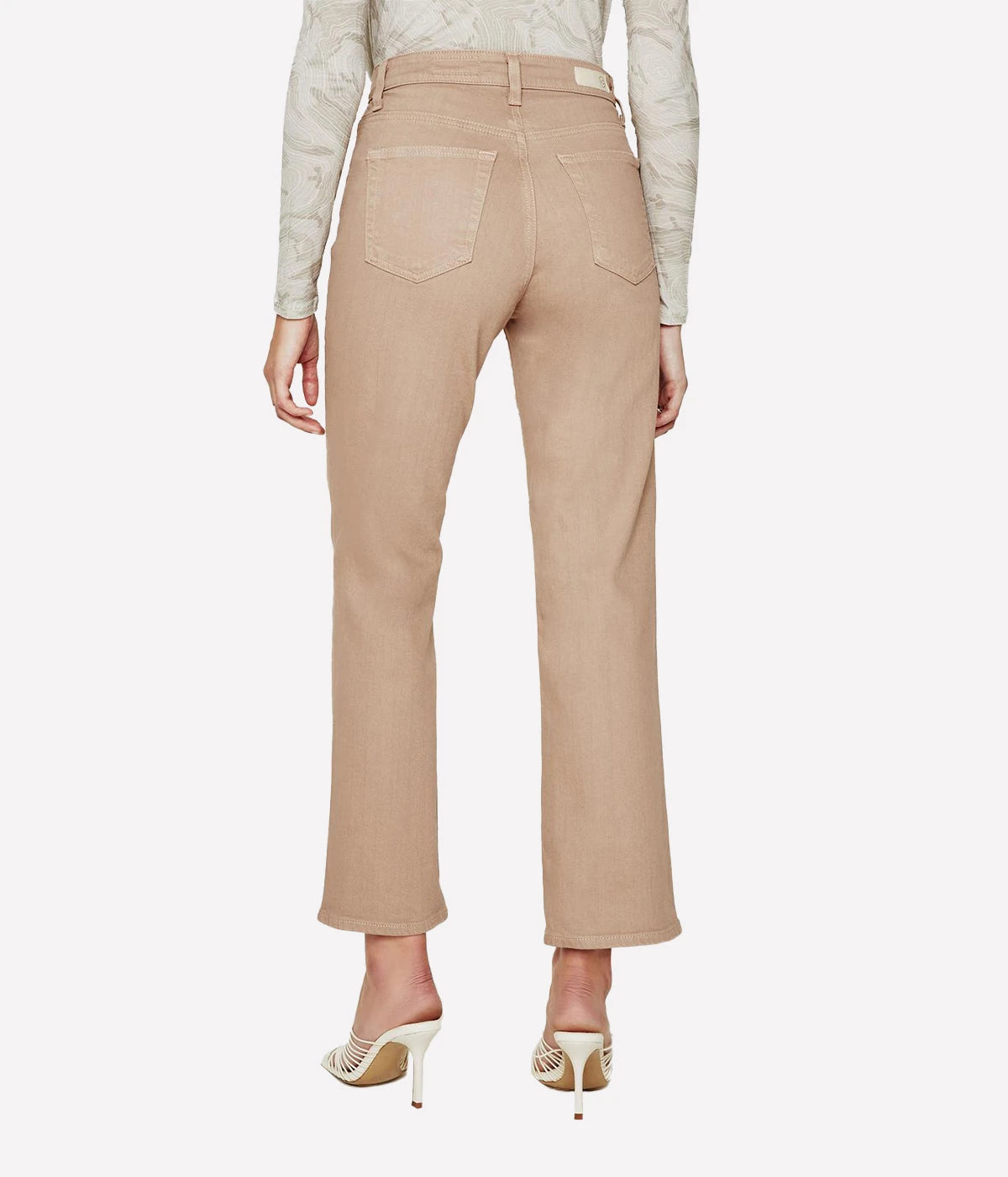 Cropped flare jeans in warm beige with an ultra-high waist, button fly, and subtle fading, styled for casual and polished looks.