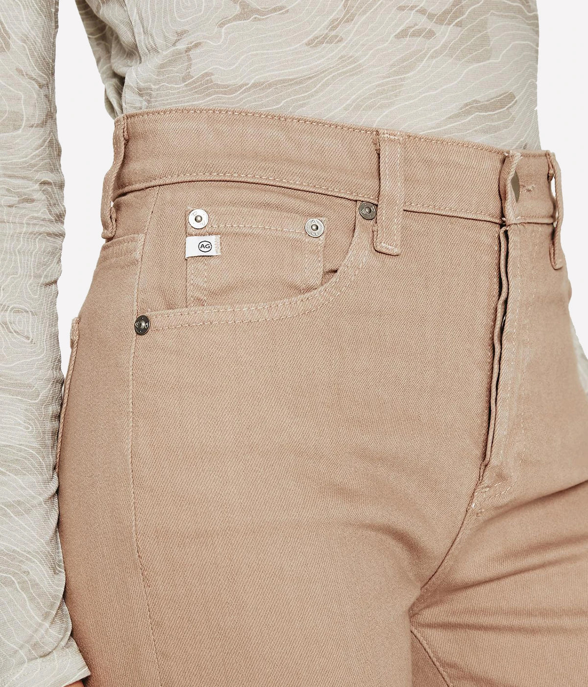Cropped flare jeans in warm beige with an ultra-high waist, button fly, and subtle fading, styled for casual and polished looks.