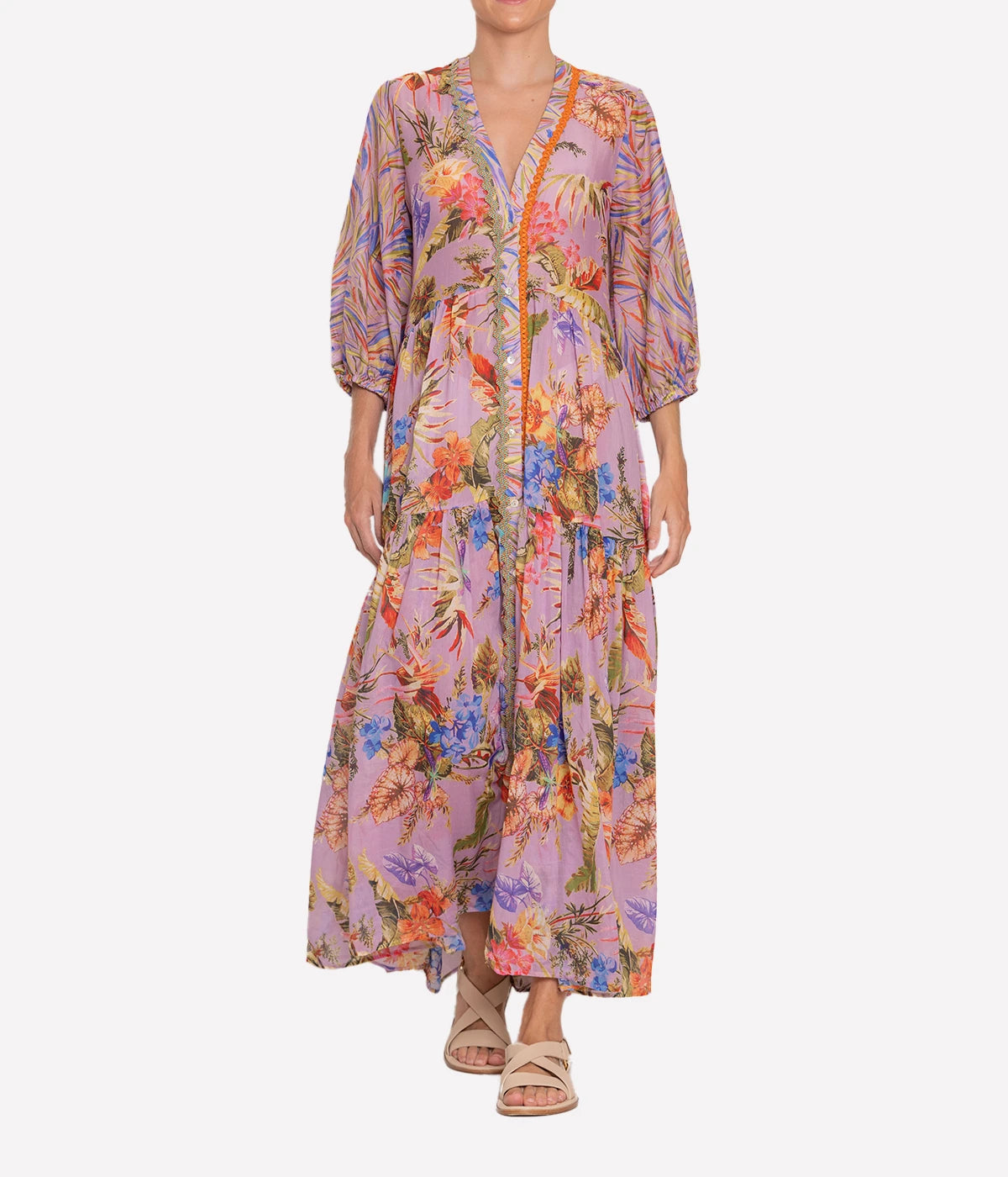 Image of a pink tropical floral print maxi dress, featuring a v neckline,  front button fastening and elasticated sleeves