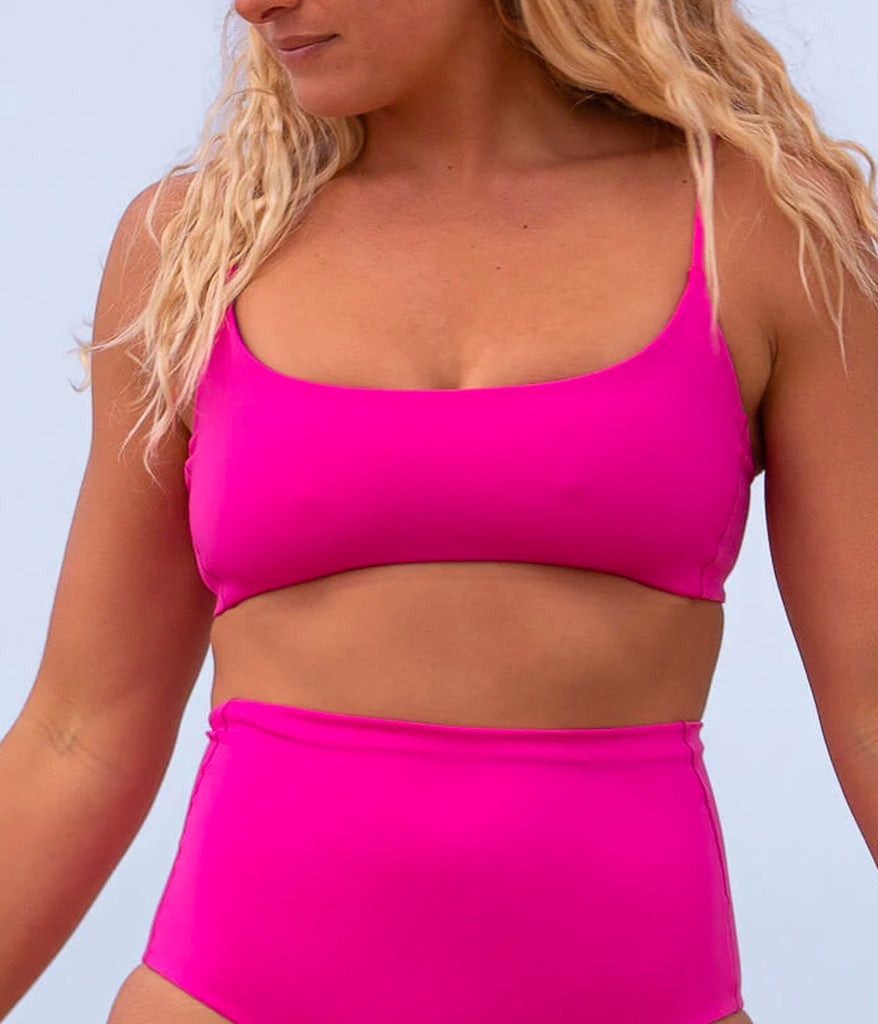 Wear the Pool Days Top in Hot Pink from the sea to the bar this summer. With a scoop neckline, this double lined bikini offers medium coverage for all busts. Enjoy minimal tan lines and wear this top all day, in the water or on the town.