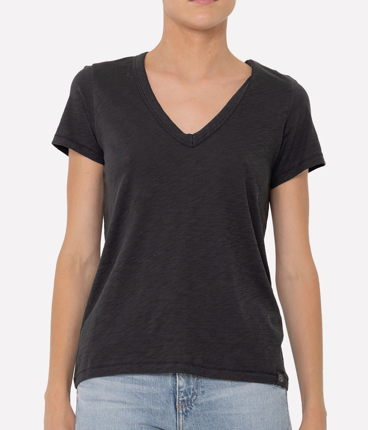 ALT TEXT: White V-neck T-shirt with short sleeves and relaxed fit in soft Pima cotton
